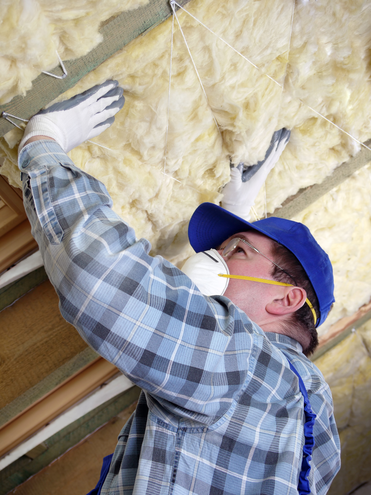 lady baltimore insulation co servicing a house in maryland installing rock wool insulation for sound proofing the attic